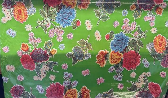Mums on Green Oilcloth Fabric by the Yard - 47.5" Wide